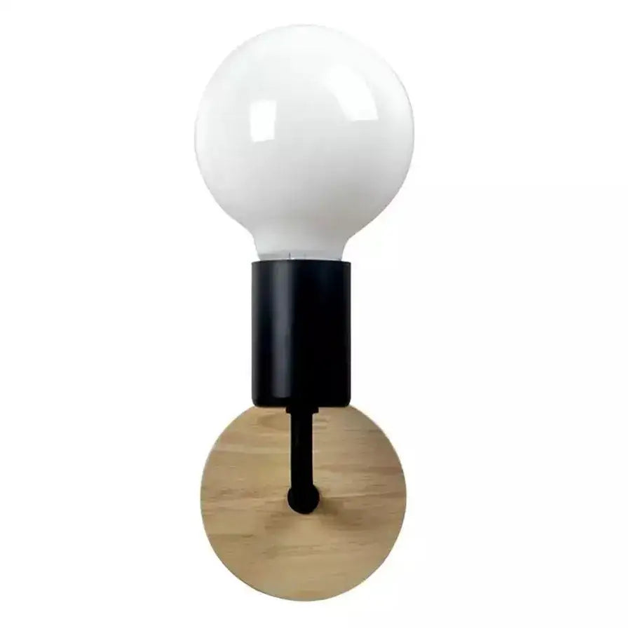 Modern black and white iron art wall light with frosted glass bulb and matte black stem on a light wood disc decorbites iron art