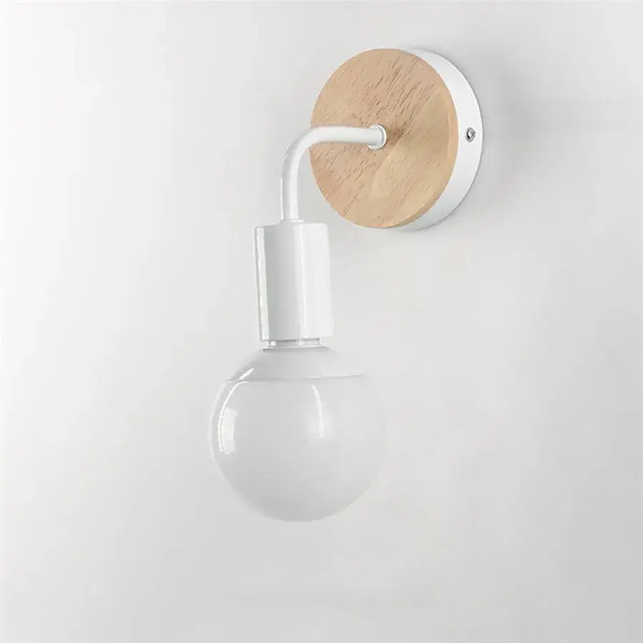 Minimalist wall light with round natural wood backplate, white metal arm, and frosted glass globe by decorbites iron art