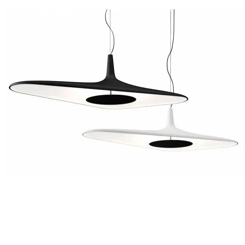 Modern black and white irregular pendant light with sleek elongated oval shapes and contrasting black centers for dining room decorbites