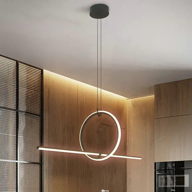 Modern black and white led ceiling chandelier with sleek circular ring and bar emitting warm glow by decorbites black led