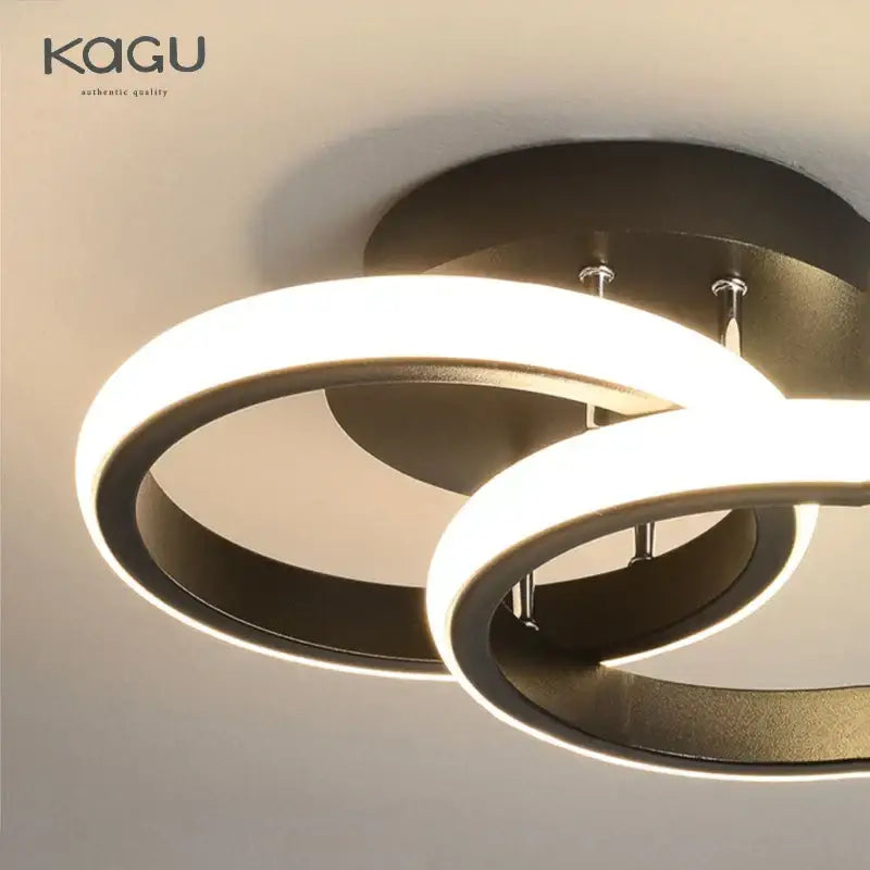 Modern black and white decorbites led ceiling lamp with sleek intertwined ring design for living room decor