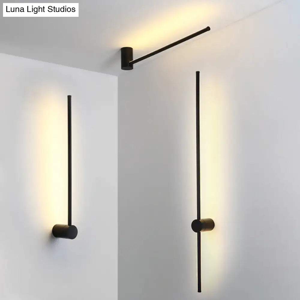 Modern black and white led metal wall sconce with slender rods and cylindrical bases for indoor lighting use