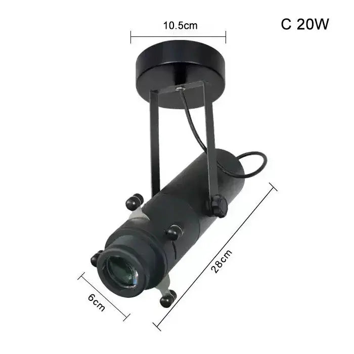 Modern black and white led track light featuring a black cylindrical spotlight with matte finish and adjustable bracket