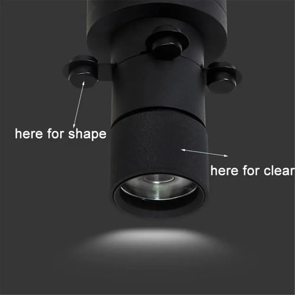 Modern black and white led track light featuring a matte black cylindrical ceiling-mounted spotlight with adjustable hardware