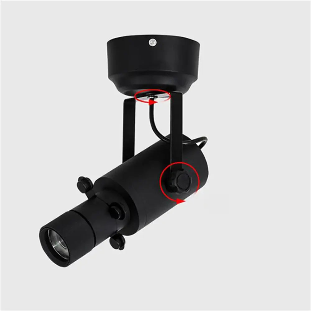 Modern black matte-finished adjustable led track light with cylindrical body and directional lens for gallery spotlight use