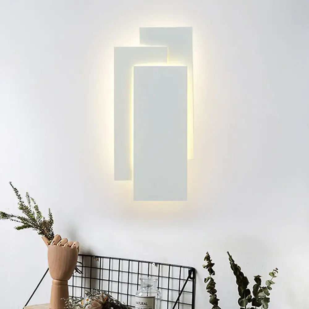 Modern black and white wall lamp with layered minimalist design and fixture height 5in providing warm ambient lighting