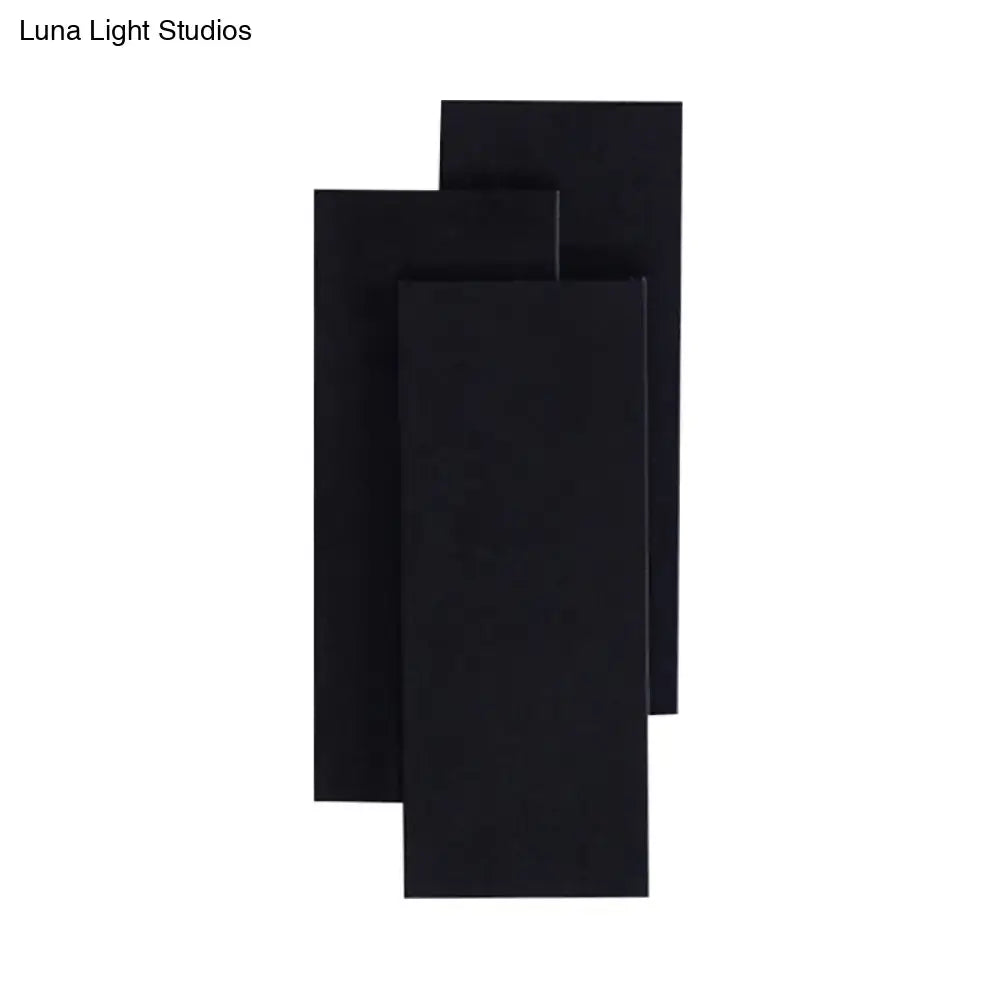 Modern black and white wall lamp with minimalist design and fixture height of 5in for bedroom lighting