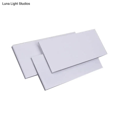 Three sleek white acrylic panels with glossy finish on modern black white led wall lamp fixture height 5in