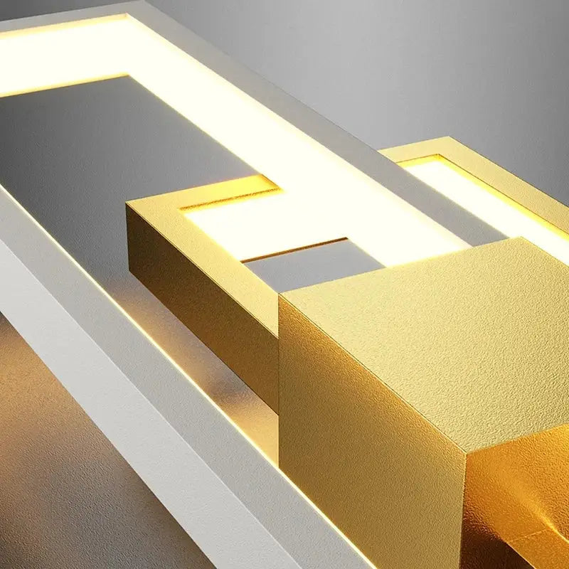 Modern black and white led wall lamp with sleek gold and white geometric design casting warm light, ideal minimalist sconce