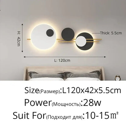Modern black and white led wall lamp with three circular fixtures connected by a gold-toned bar for bedroom lighting