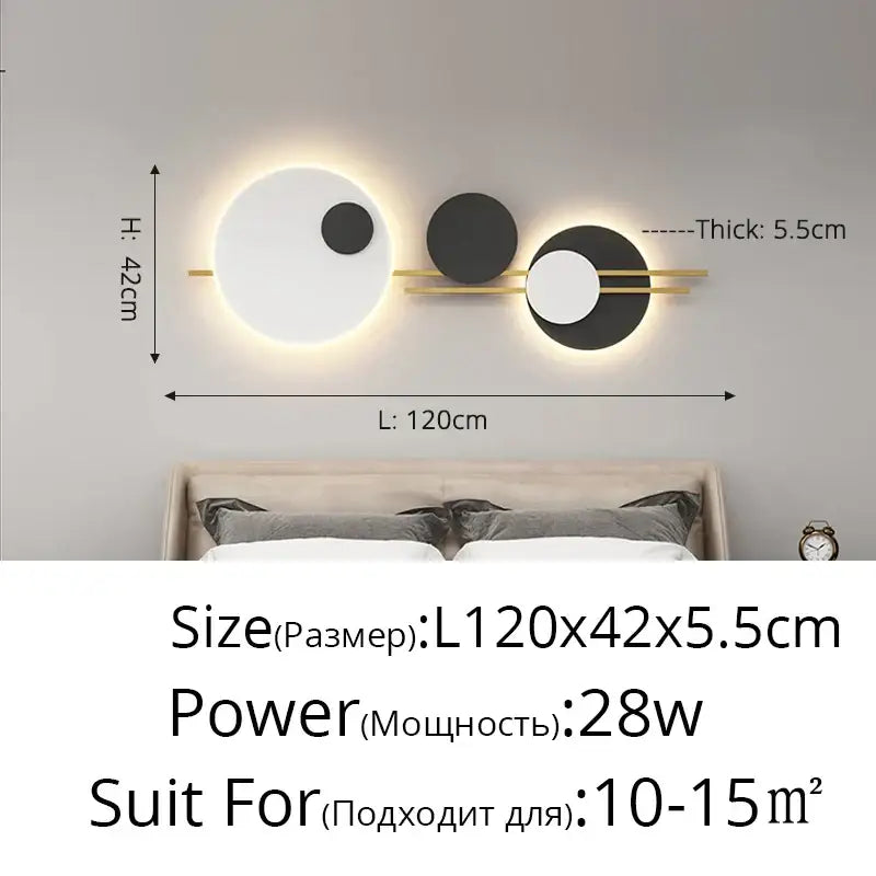 Modern black and white led wall lamp with three circular fixtures connected by a gold-toned bar for bedroom lighting