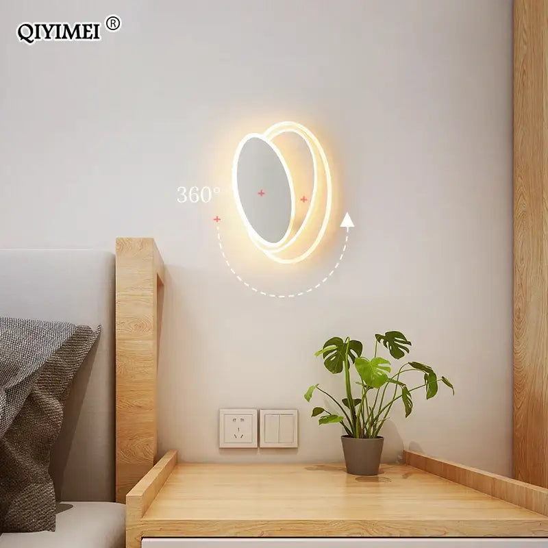 Modern black and white led wall lamps featuring a circular led wall mirror with warm glow and 360-degree rotation