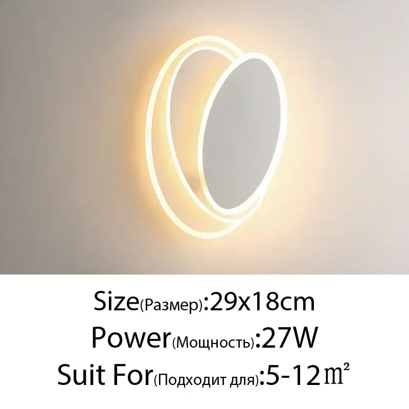 Modern black and white led wall lamps featuring a circular design with concentric glowing rings and warm illumination