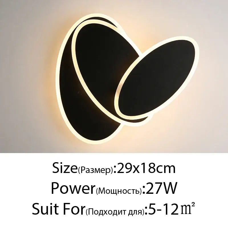 Modern black and white led wall lamps with sleek overlapping oval design for bedroom sculptural wall lamps