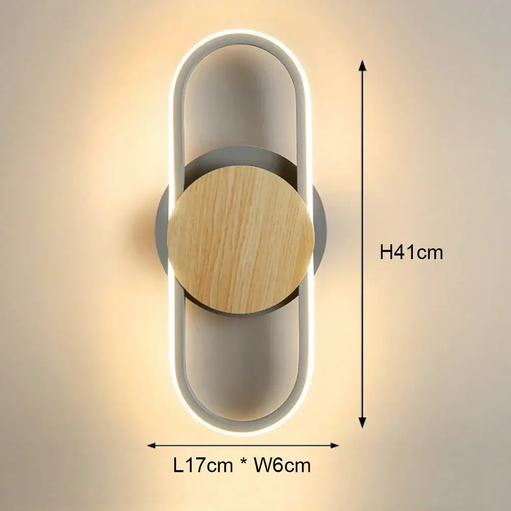 Modern black and white led wall light with sleek white acrylic body and circular wooden accent for bedroom use