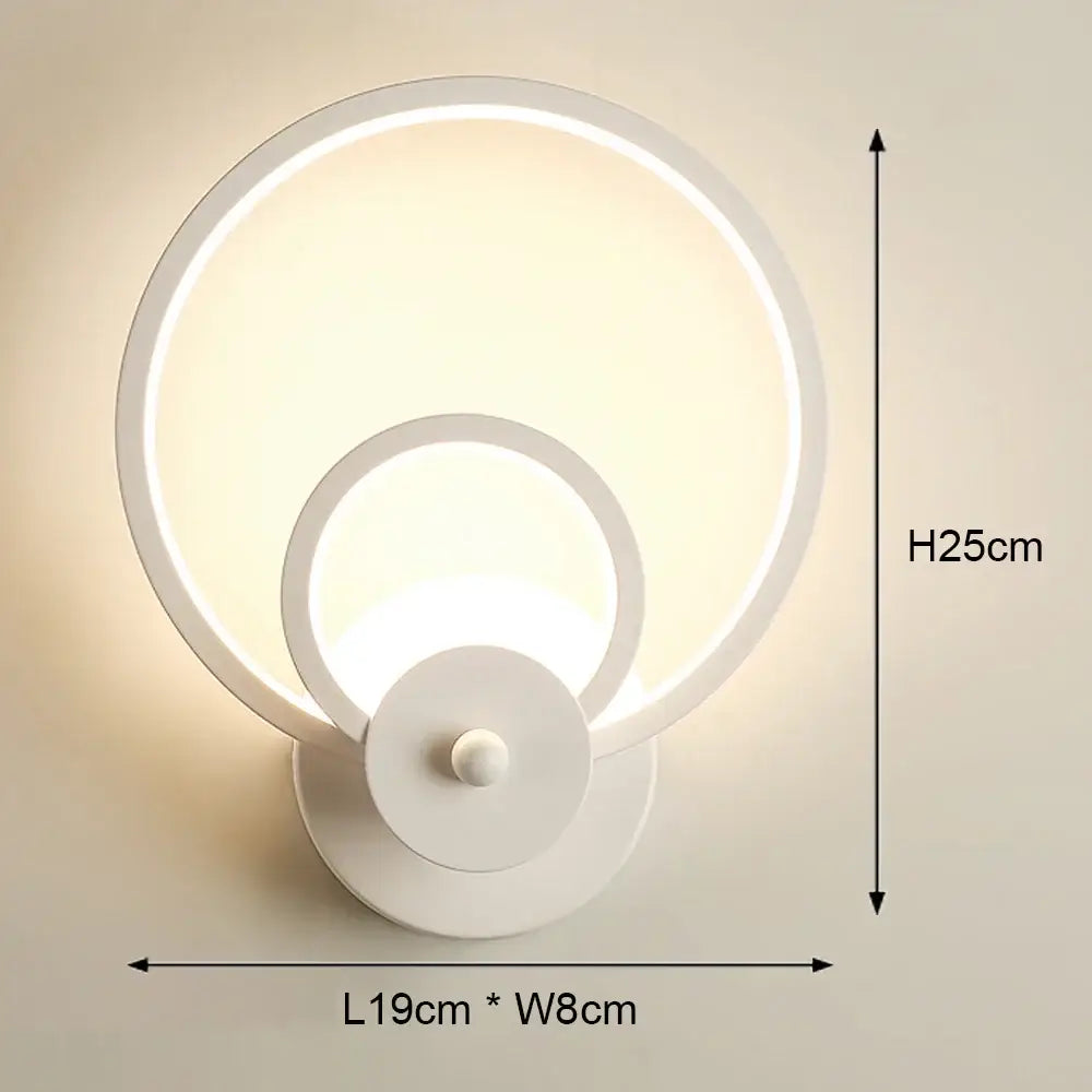 Modern white circular led wall light with concentric ring design for bedroom geometric sconce lighting