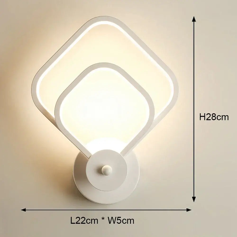 Modern black and white led wall light featuring a sleek white led wall sconce with overlapping square design for bedroom