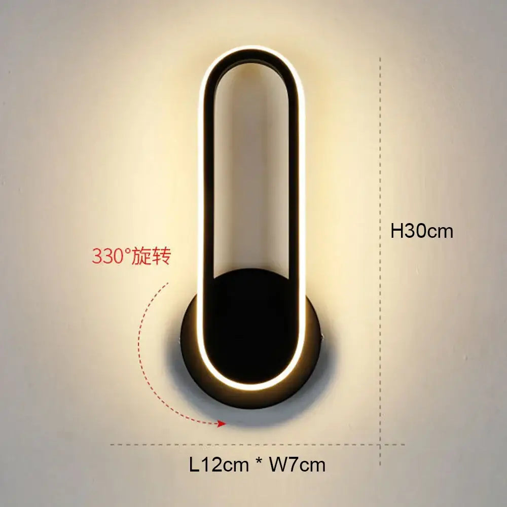 Modern black and white led wall light with sleek minimalist oval design for bedroom geometric wall light use
