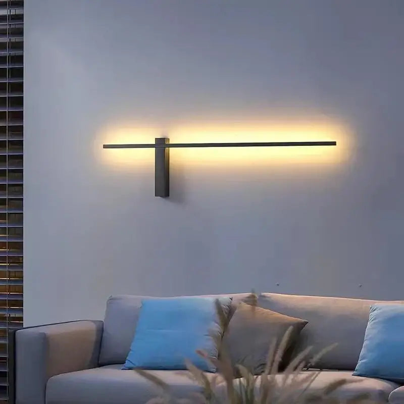 Modern black metal wall lights with sleek horizontal bar emitting warm ambient light for minimalist living room decorbites led wall