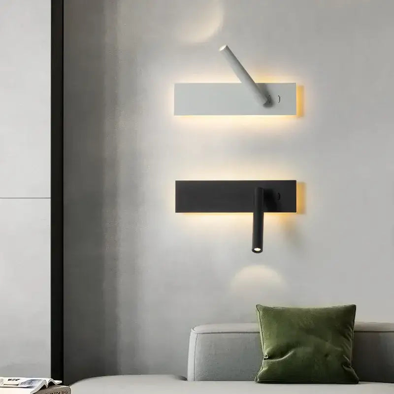 Modern black and white led wall reading lamp with sleek rectangular bases and adjustable arms emitting warm light
