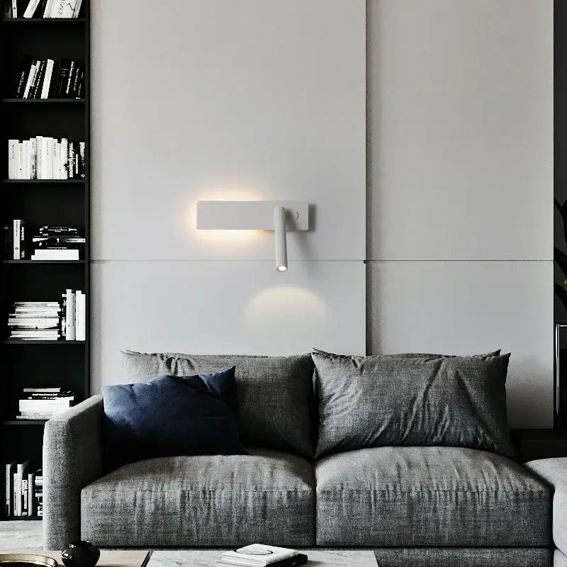 Modern black and white led wall reading lamp with sleek white rectangular body and adjustable downward beam by decorbites