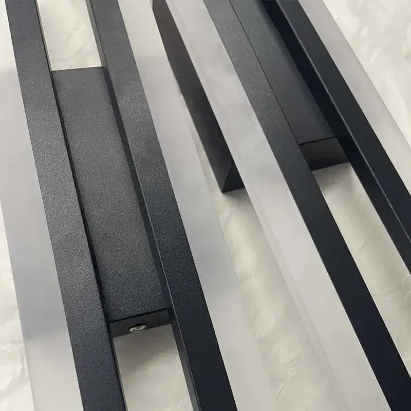 Modern black and white led wall sconce lamp with black matte metal slatted radiator design for bedroom lighting