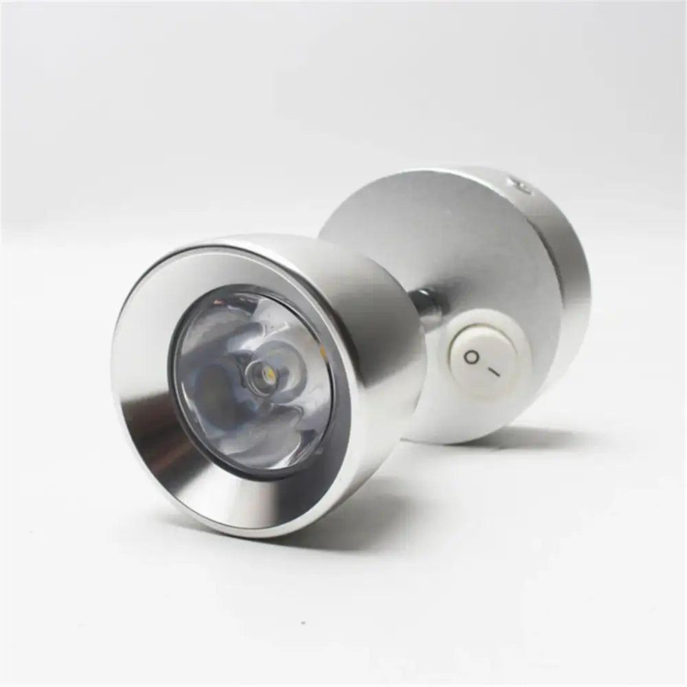 Silver metallic led spotlight wall lamp with circular lens and white power button for decorbites led wash reading use