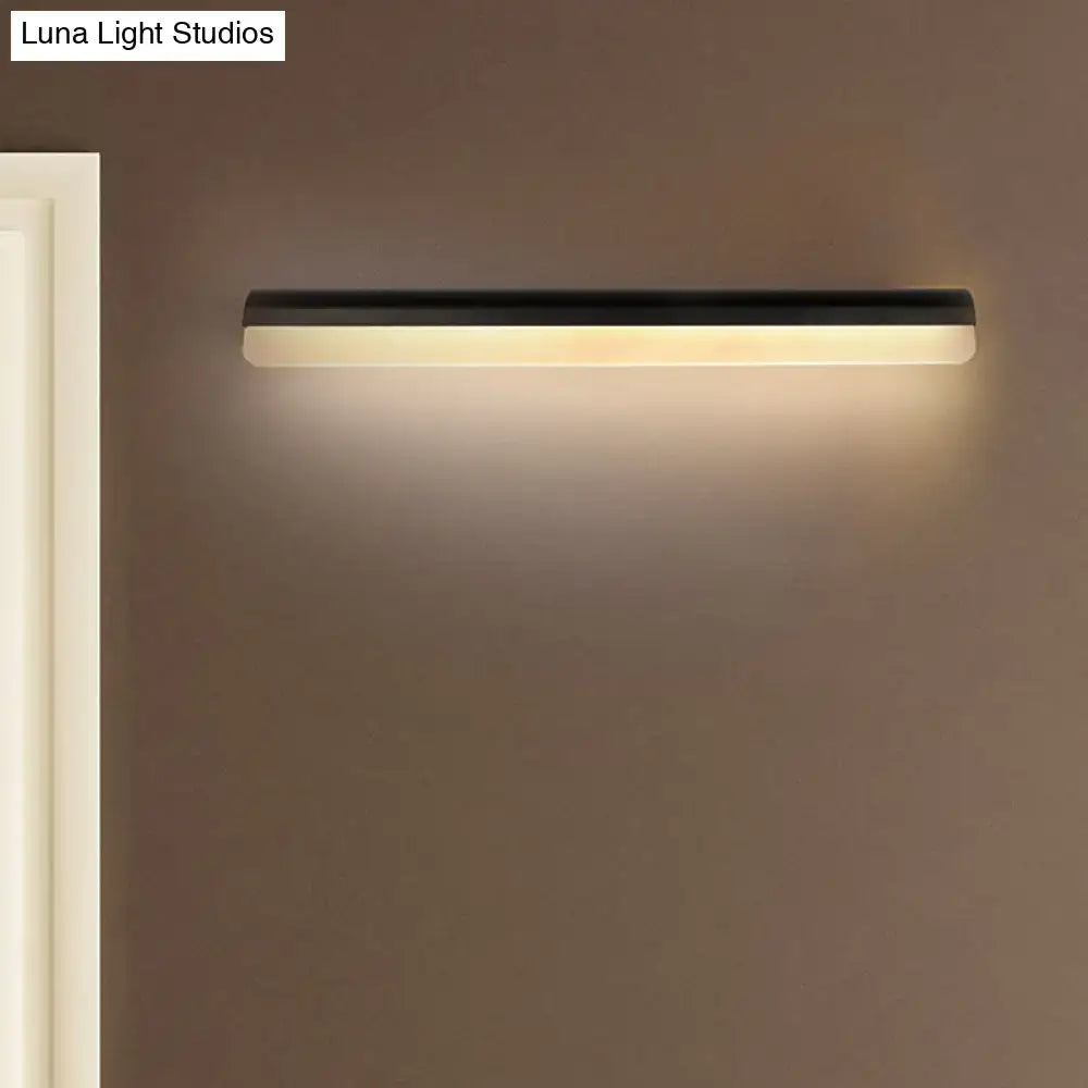 Modern black and white linear led wall light bathroom sconce with sleek rectangular design and warm white illumination