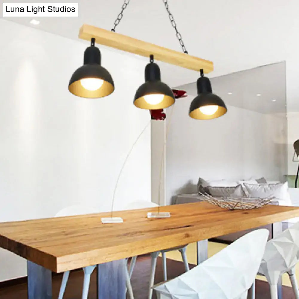 Decorbites modern dome island lighting with three black metal shades and wooden beam suspended by chains for kitchen