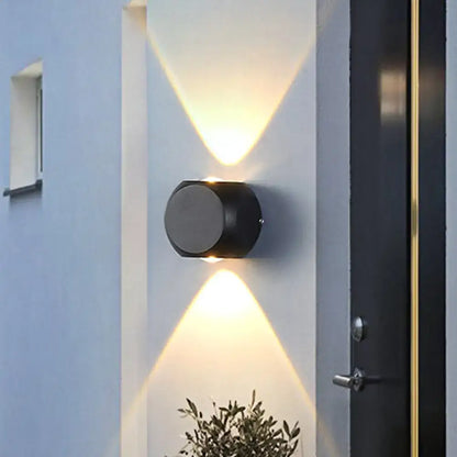 Modern black and white mini cube wall lamp with black cylindrical dual angled lights illuminating living room wall lamp