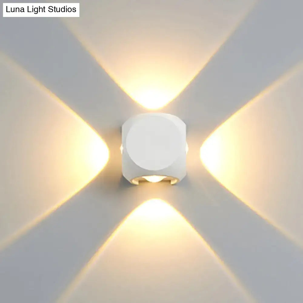 Modern black and white mini cube wall lamp with white geometric sconce and four directional warm light beams for living room