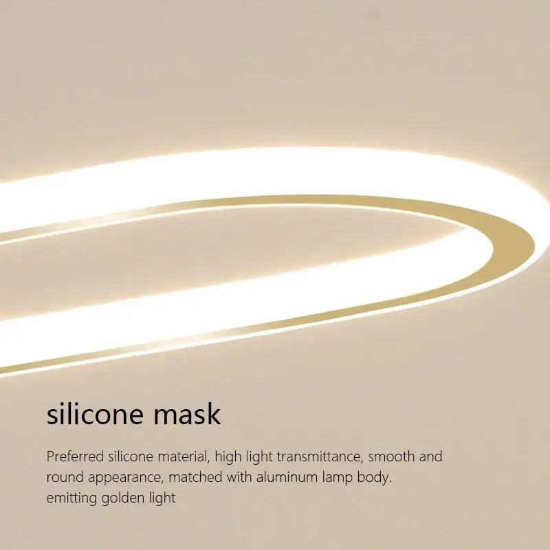 Modern black and white oval led chandelier featuring a sleek curved silicone mask emitting golden light with aluminum body