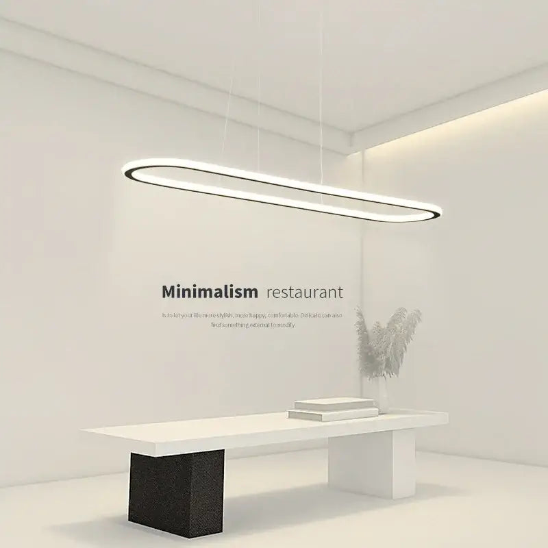 Modern black and white oval led chandelier with sleek elongated oval design and thin black frame for dining room lighting