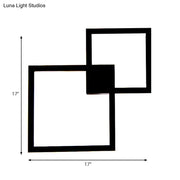 Modern black wall sconce with two overlapping 17 inch acrylic shade squares for dining room decor