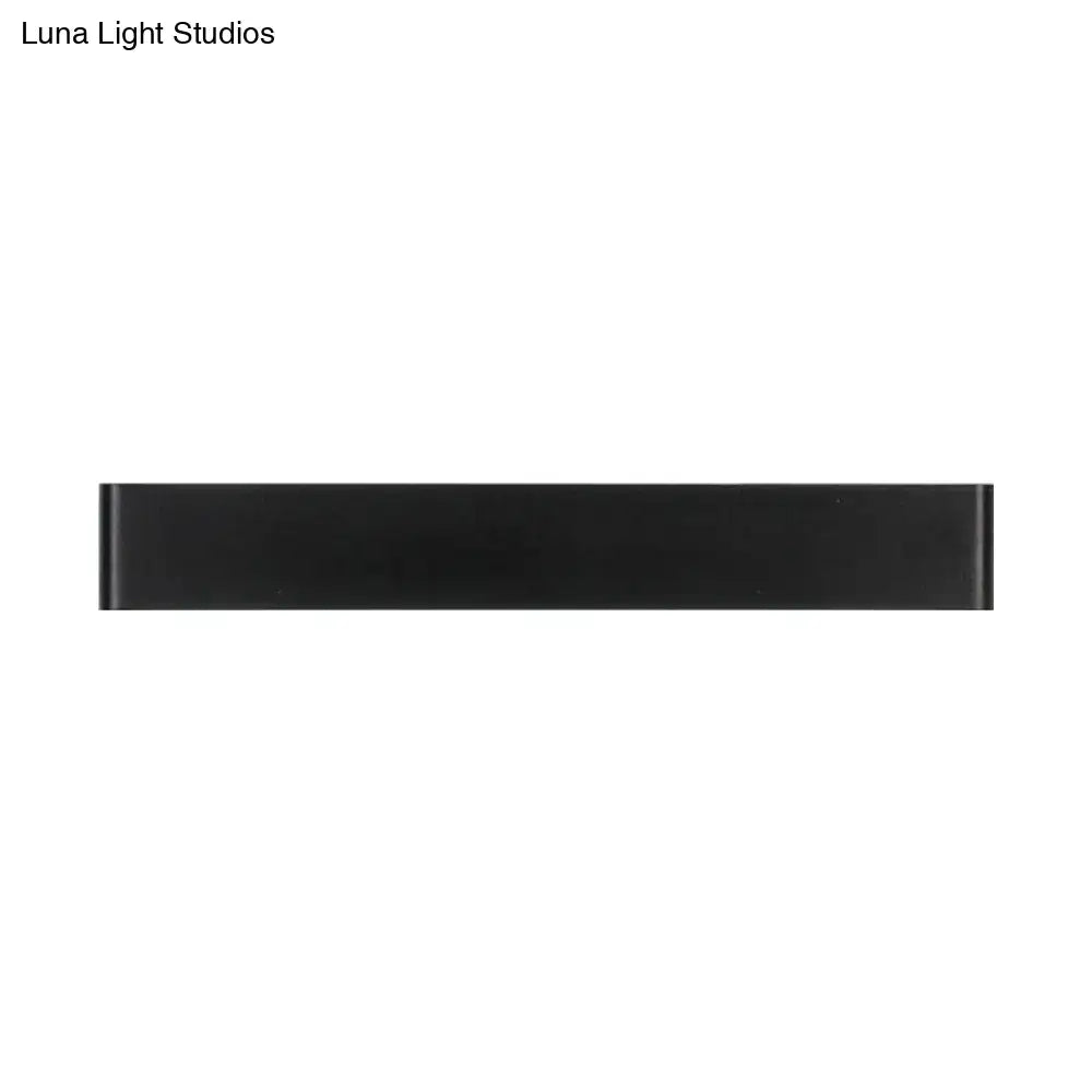 Modern black and white wall lamp with a sleek rectangular metal shade for living room light fixture use