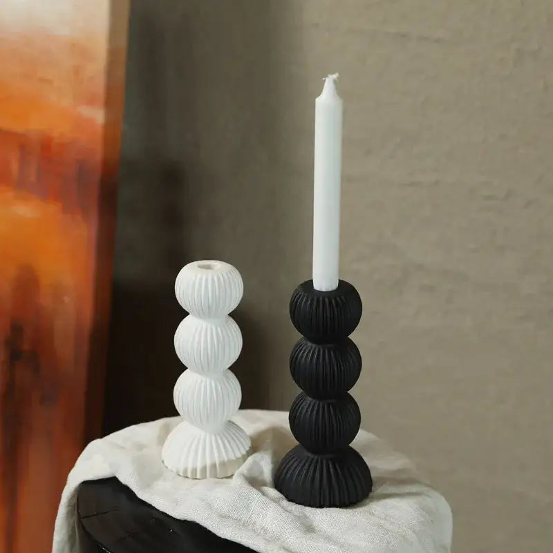 Modern black and white ribbed geometric ceramic candle holder featuring stacked spherical design for living room decorbites decor