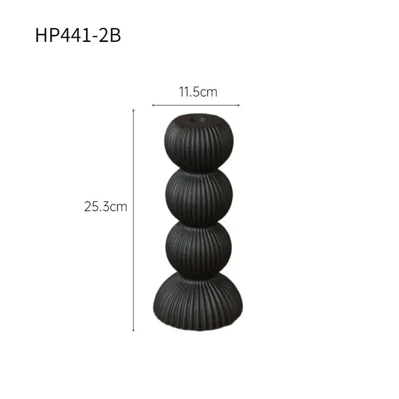 Modern black ceramic candle holder with four stacked ribbed spheres by decorbites geometric ceramic candle decor