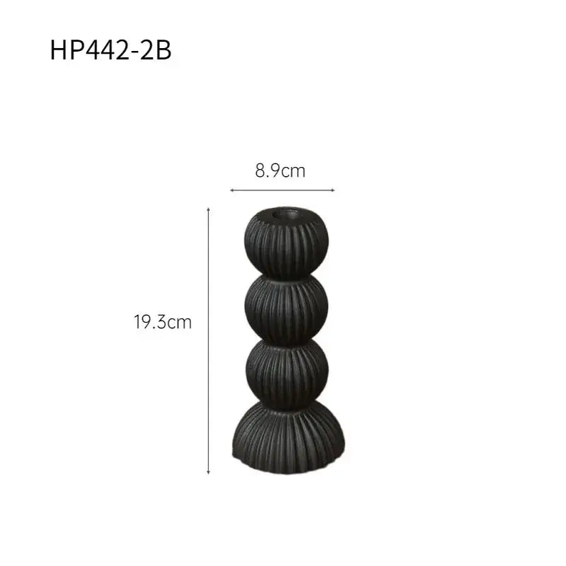 Modern black ribbed geometric ceramic candle holder with four stacked spherical tiers for stylish decorbites decor