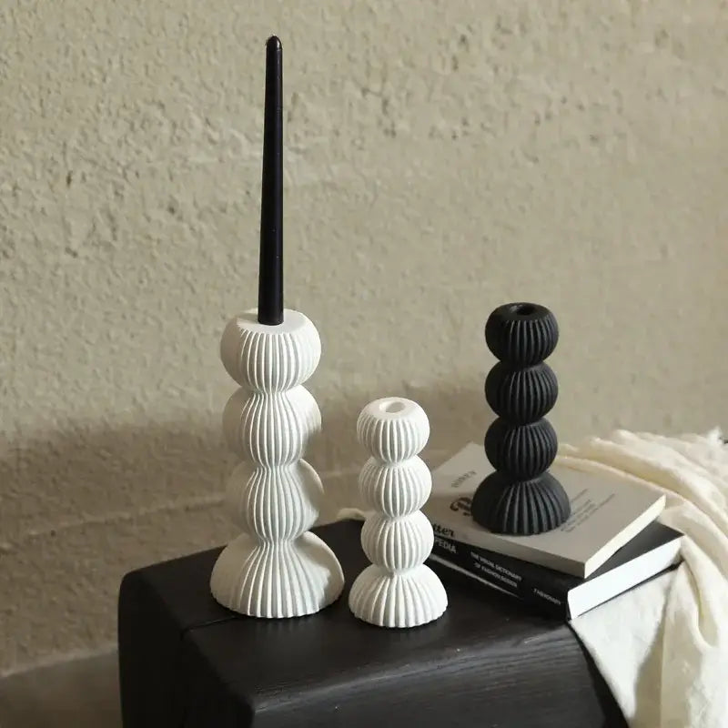 Modern black and white ribbed geometric ceramic candle holder featuring stacked spherical design for living room decorbites geometric ceramic candle