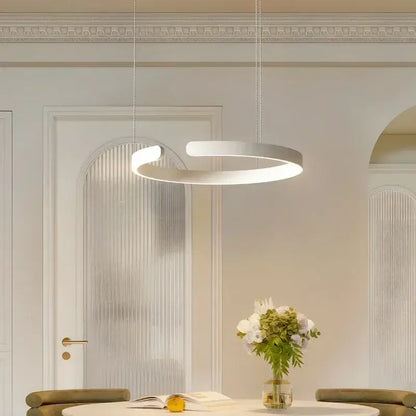 Modern white circular pendant light with sleek minimalist design featuring light guide plate as light source for dining room