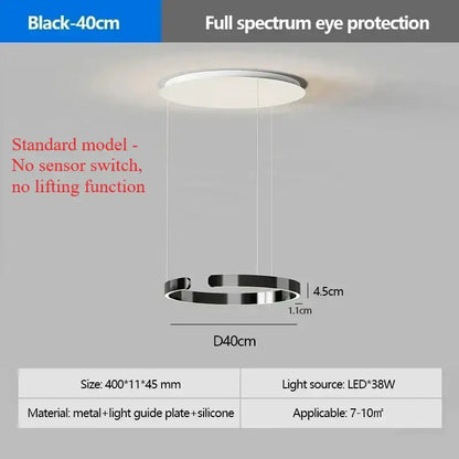 Modern black circular pendant light with sleek metal frame and silicone accents featuring led light source for eye protection
