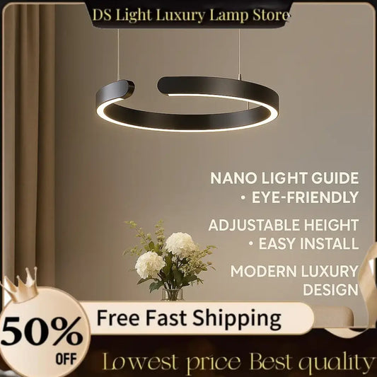 Modern black pendant light with illuminated light guide plate ring as LED dining room light source