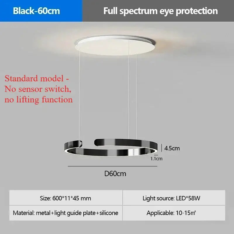 Modern black circular pendant light with metal and silicone components featuring an LED light source and light guide plate