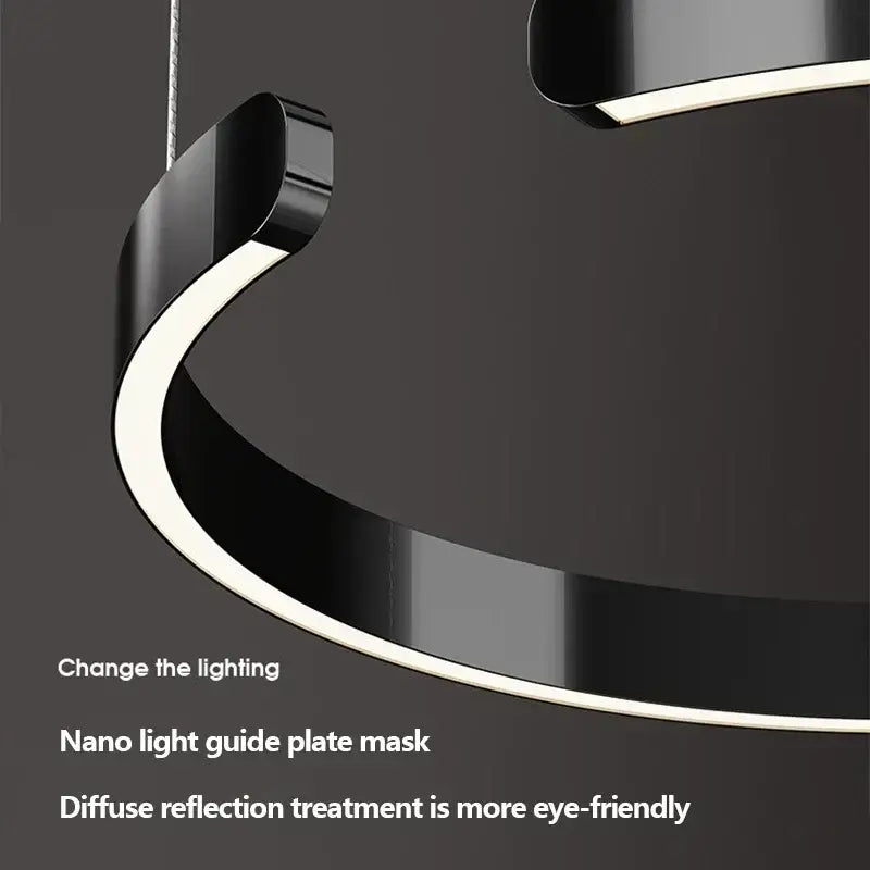 Modern black curved led pendant light with integrated light guide plate serves as a sleek dining room light source