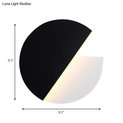 Modern black and white rotatable acrylic wall lamp with sleek circular design for bedroom wall lamp use
