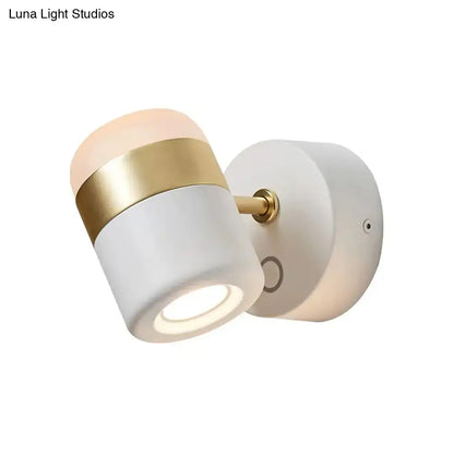 Modern black and white rotatable led spotlight with frosted glass shade, gold band, and brass hardware bedroom wall sconce