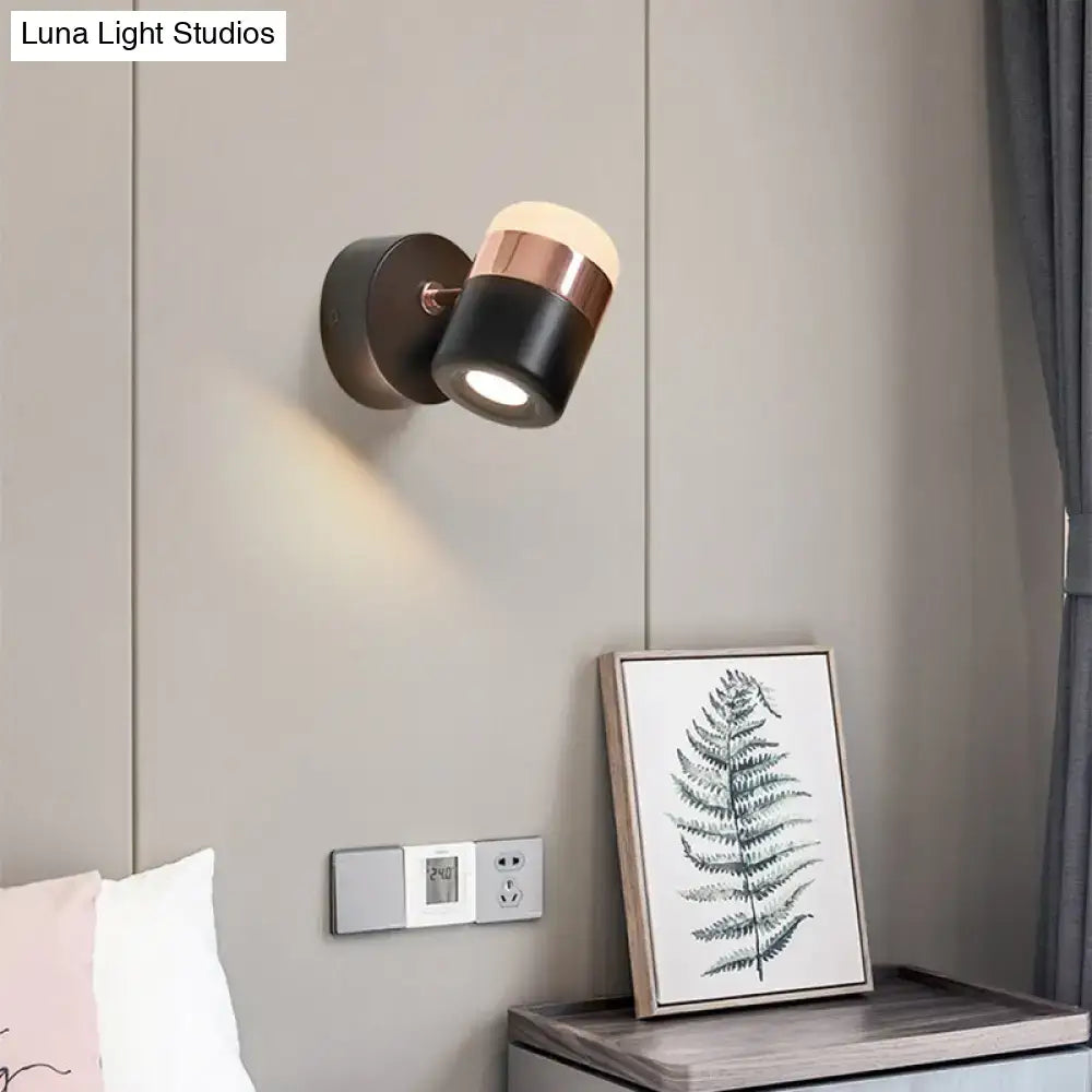 Modern black and white rotatable led spotlight wall sconce with sleek black and rose gold finish and adjustable head for focused light