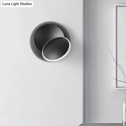 Modern black and white rotating eclipse wall lamp with circular minimalist design LED bedroom sconce