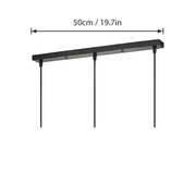 Black rectangular pendant light fixture with three cords and a modern black and white round rectangular ceiling plate