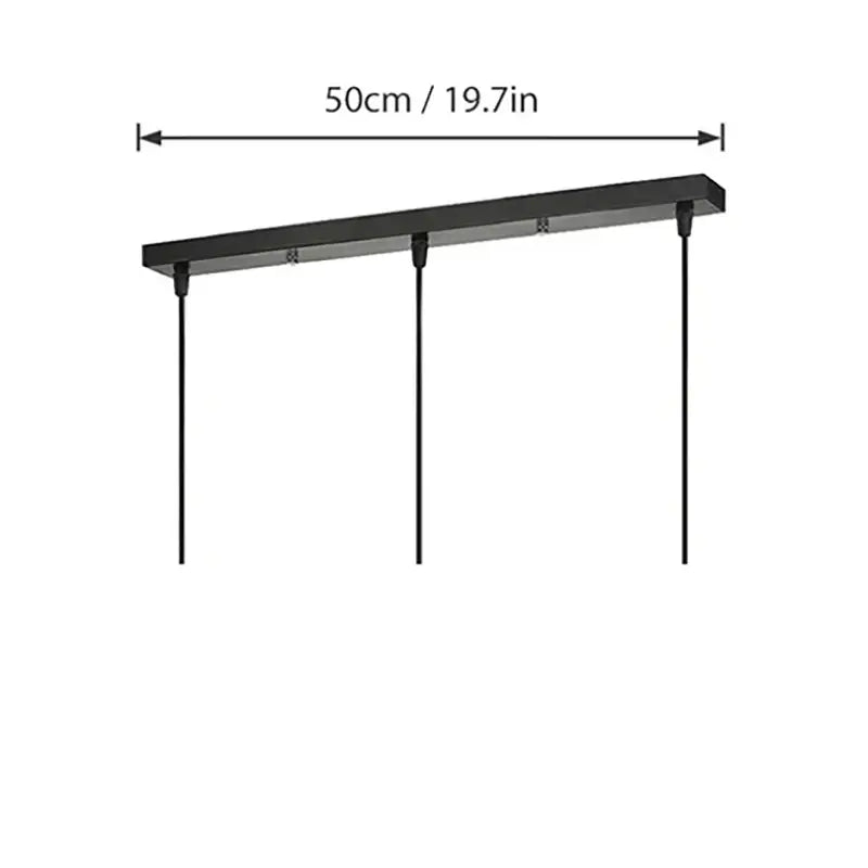 Black rectangular pendant light fixture with three cords and a modern black and white round rectangular ceiling plate